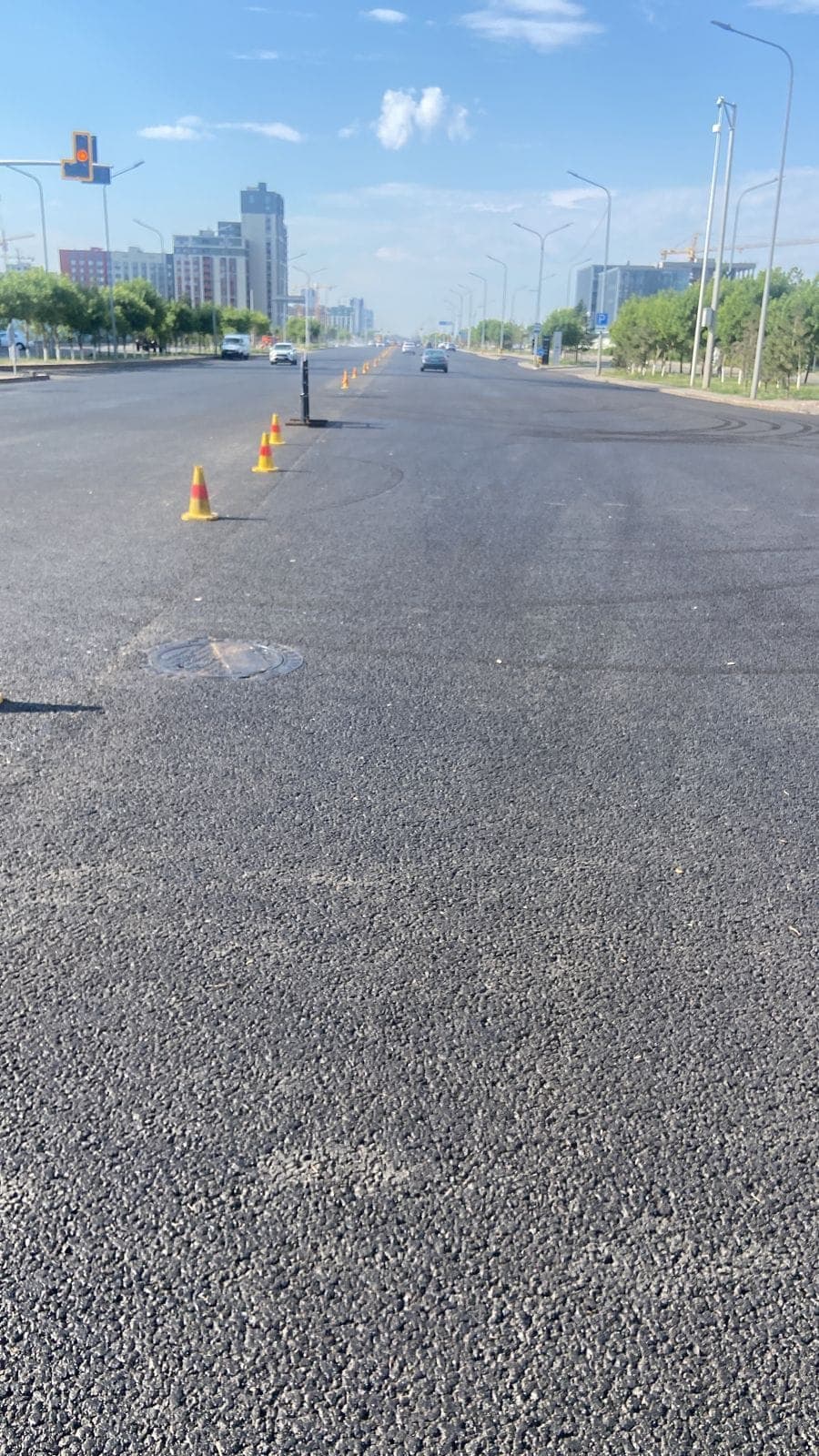 Finished pavement of Mangilik El Avenue after laying SMA-20 with Veleton MPC