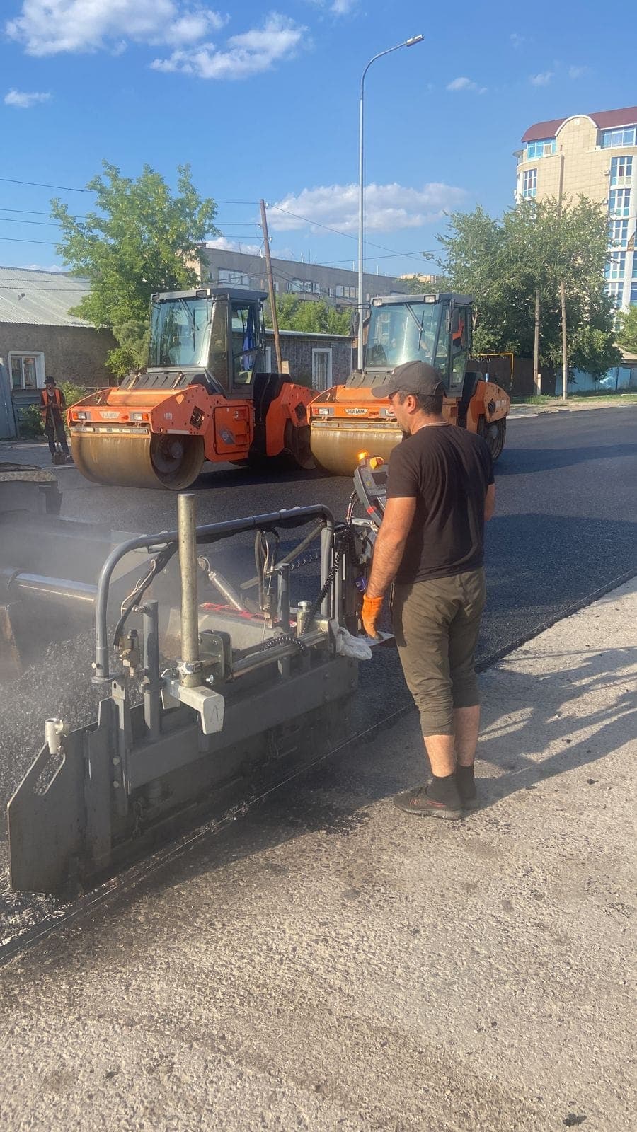 Paver and two Hamm rollers compacting SMA-20 on Moskovskaya Street