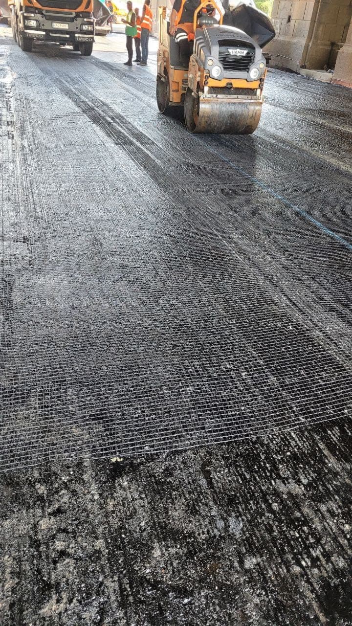 Reinforcing geogrid on the prepared foundation before paving