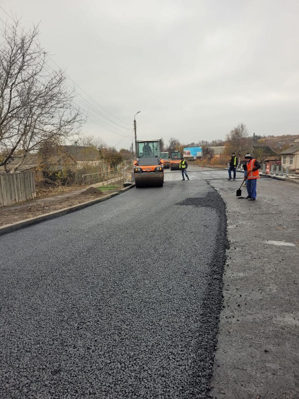 Compacting SMA with a Hamm roller on the R-44 highway in Sumy Region