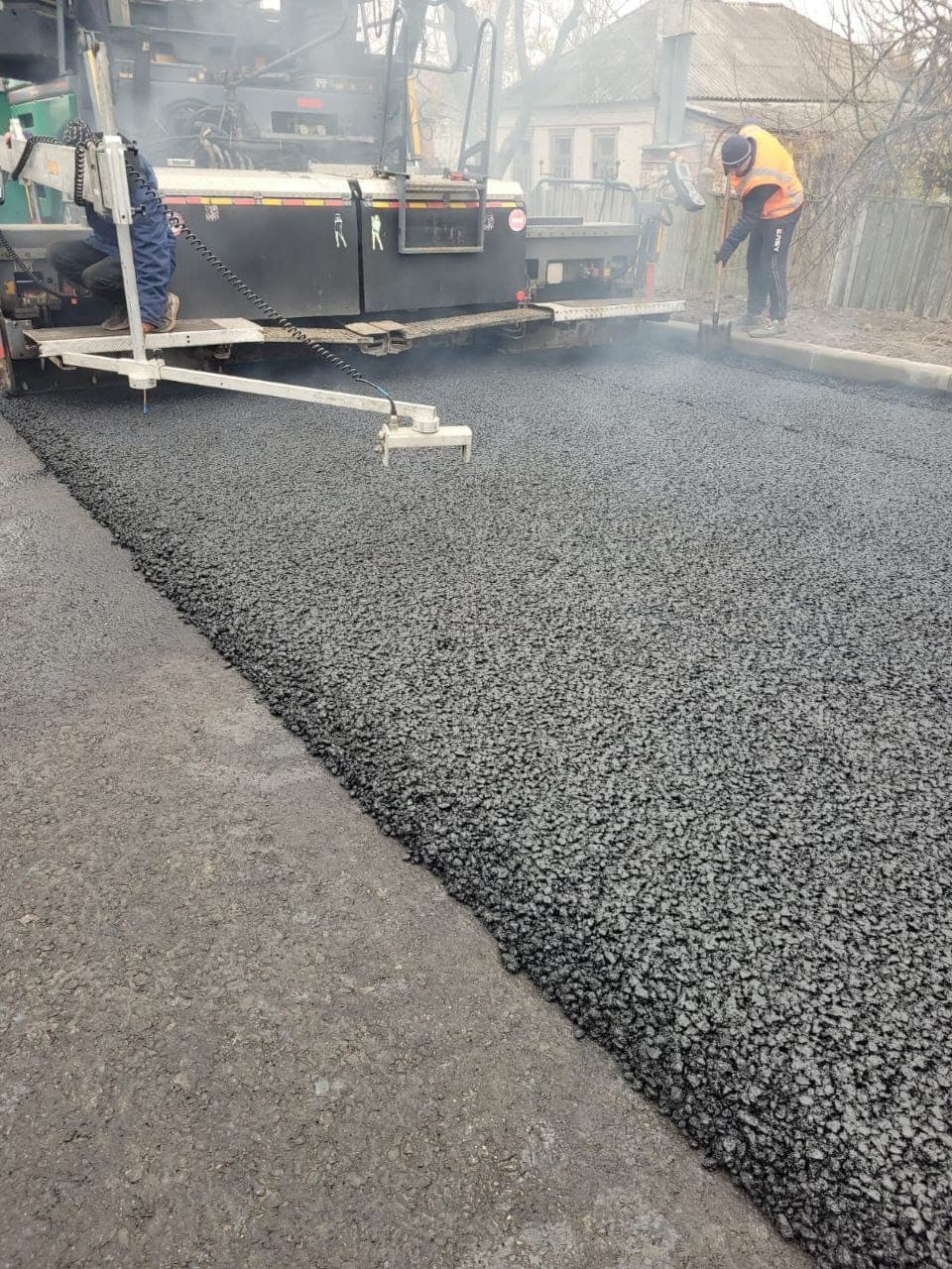 Paver feeding hot SMA mixture with Veleton ESA on the R-44 highway