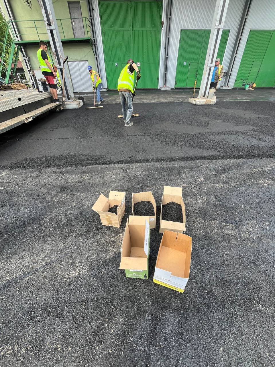 Taking samples of the mixture during paving on the plant's site